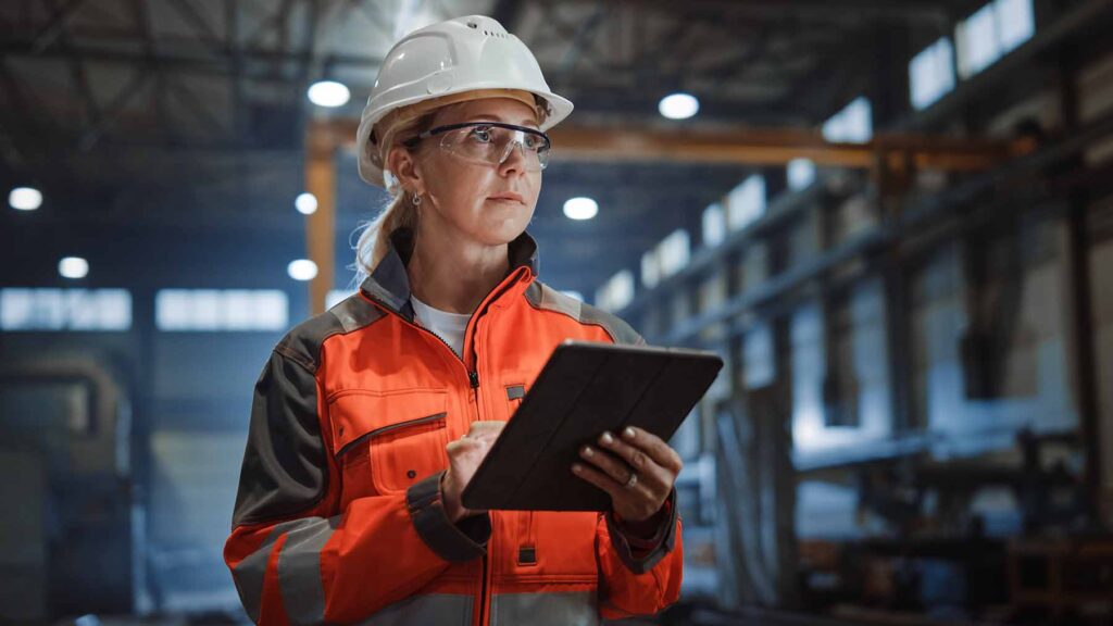 image shows female working in a factory