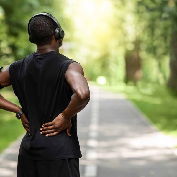 Male jogger with back pain